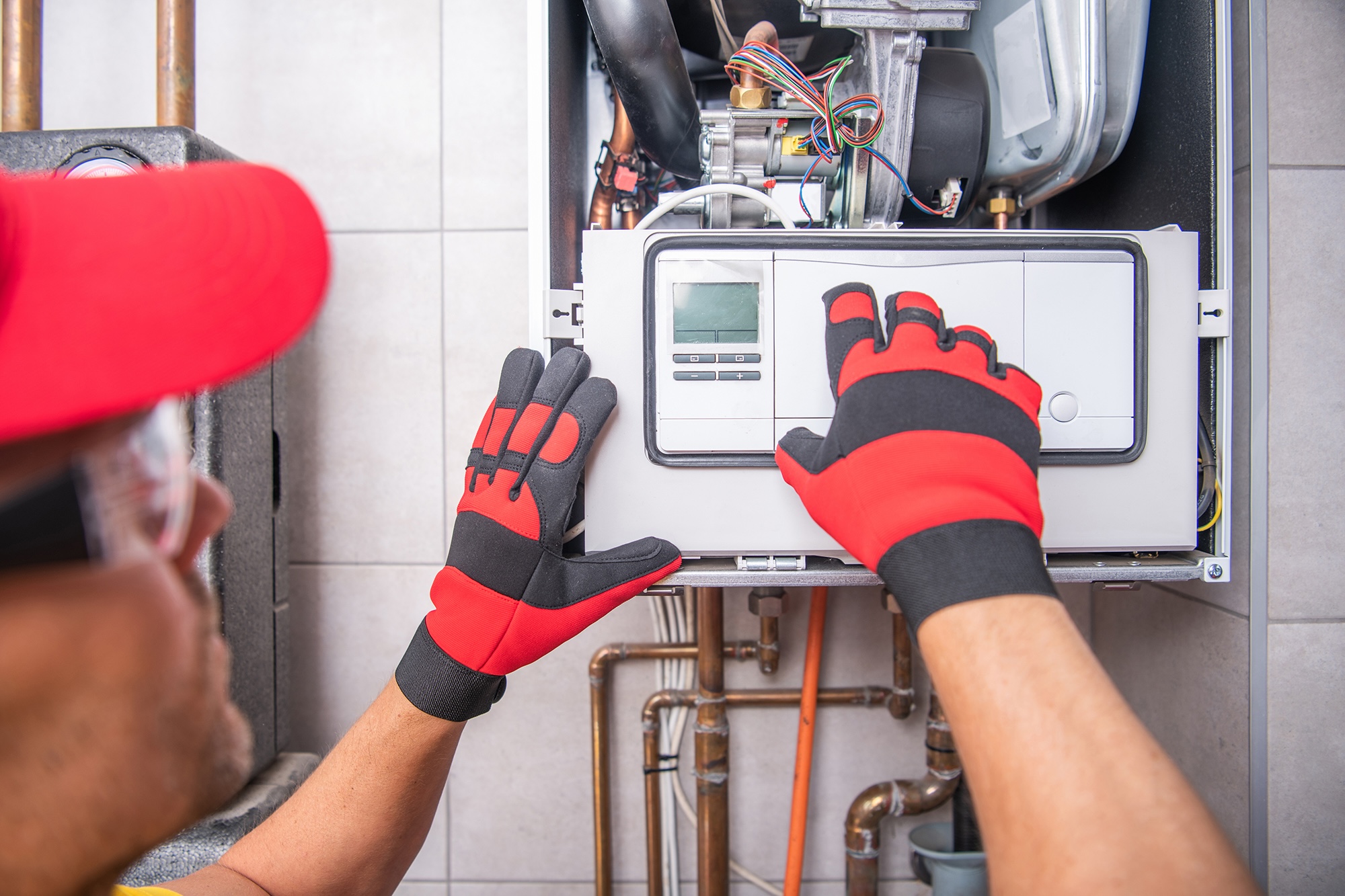 Heating engineer repairing boiler Heating engineer repairing boiler