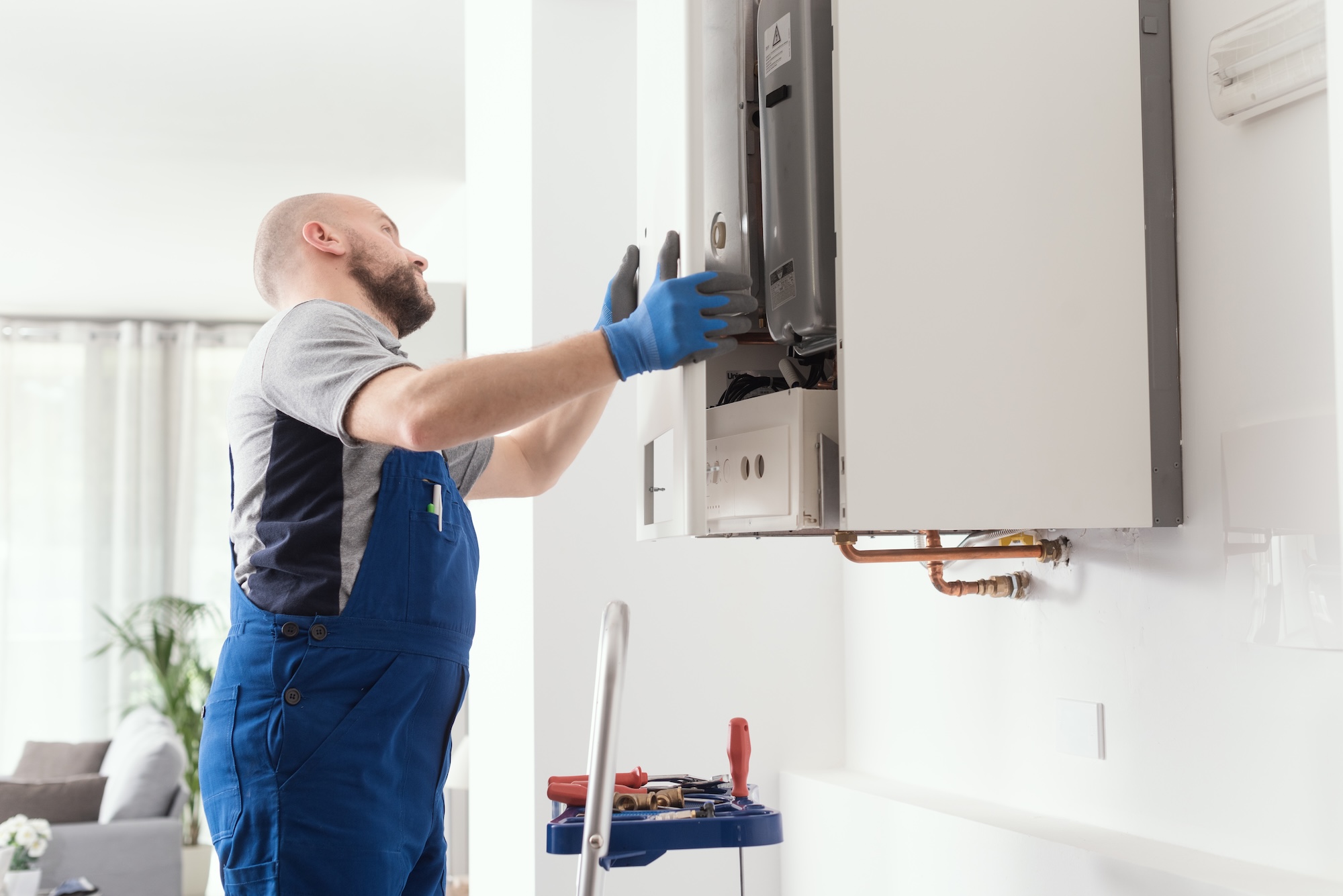 heating engineer installing new boiler at a home in Canterbury heating engineer installing new boiler at a home in Canterbury